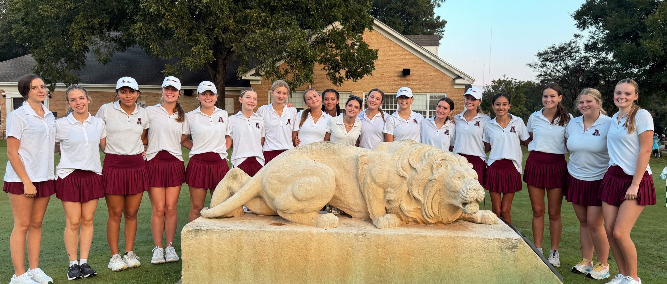 Photo of Austin High girls golfers at Lions in team photo.