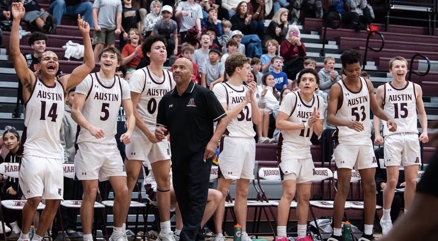 AHS basketball team winning big game on court.