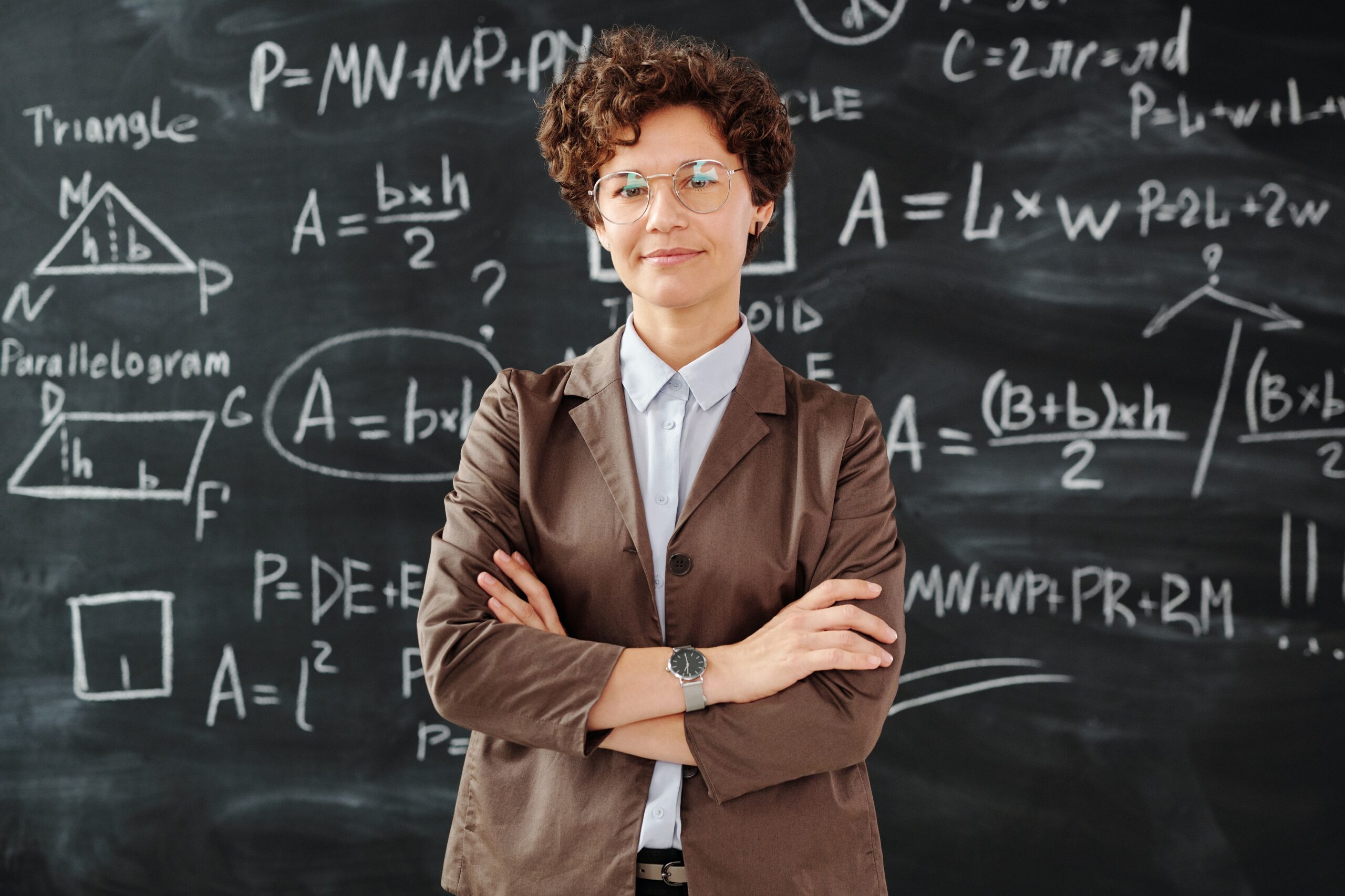 teacher in front of blackboard