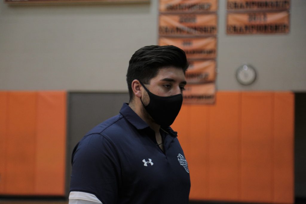 Justin Parra walks towards the bench during a match. Parra, a first-year head coach with the girls' team, has enjoyed much success during his initial run. Photo courtesy of Chicago Public League