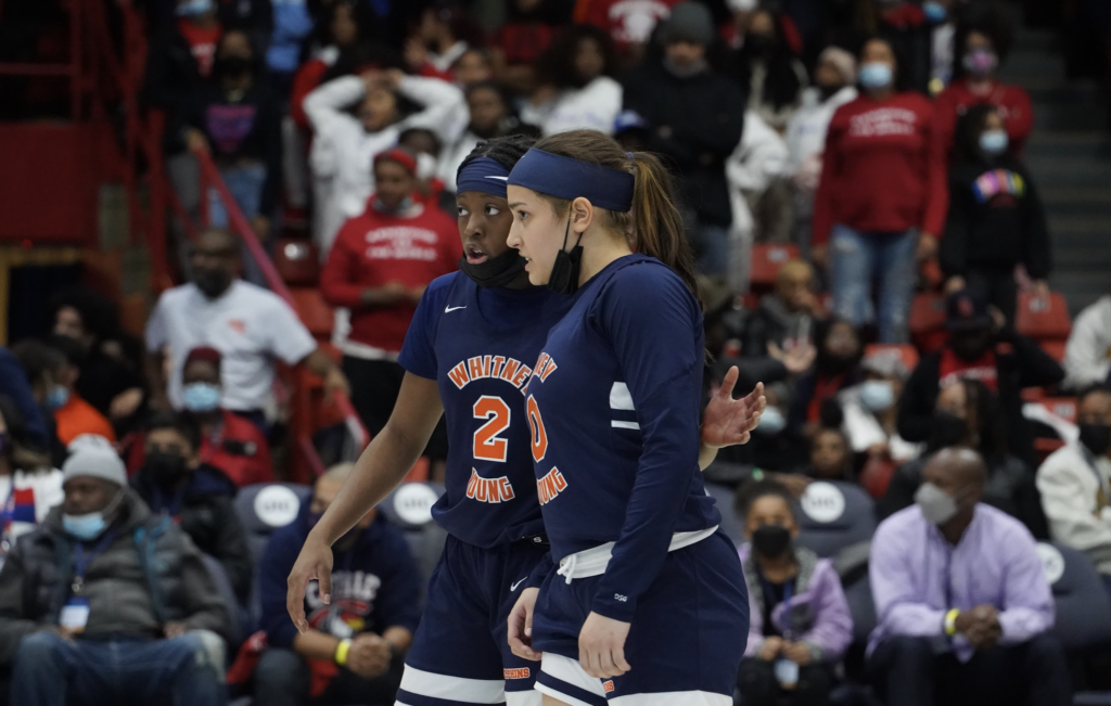 Whitney Young players talk strategy during the game. Photo by CPL