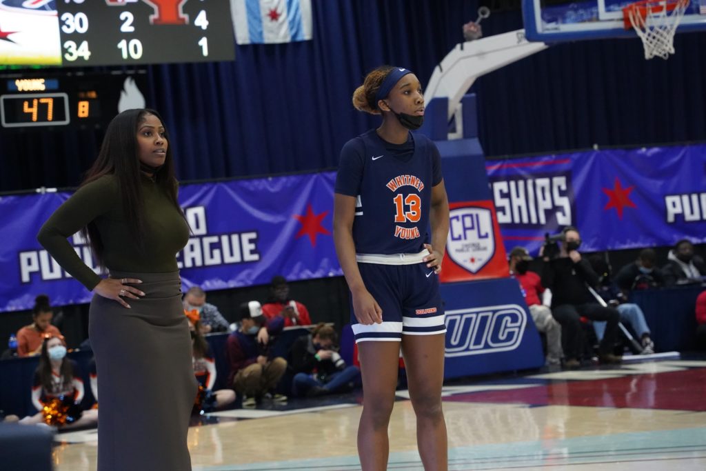 Whitney Young head coach Krissy Harper and junior Skylar Jones look on during the game. Photo by CPL