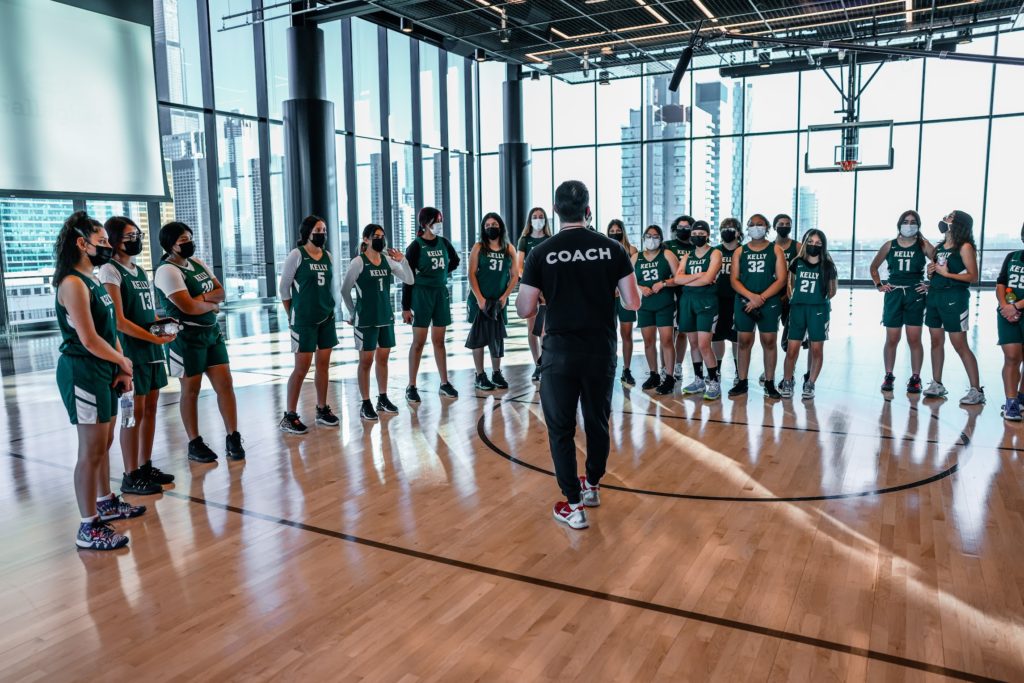 Chicago Bulls head coach Billy Donovan speaks to Kelly High School during a special event for the team.