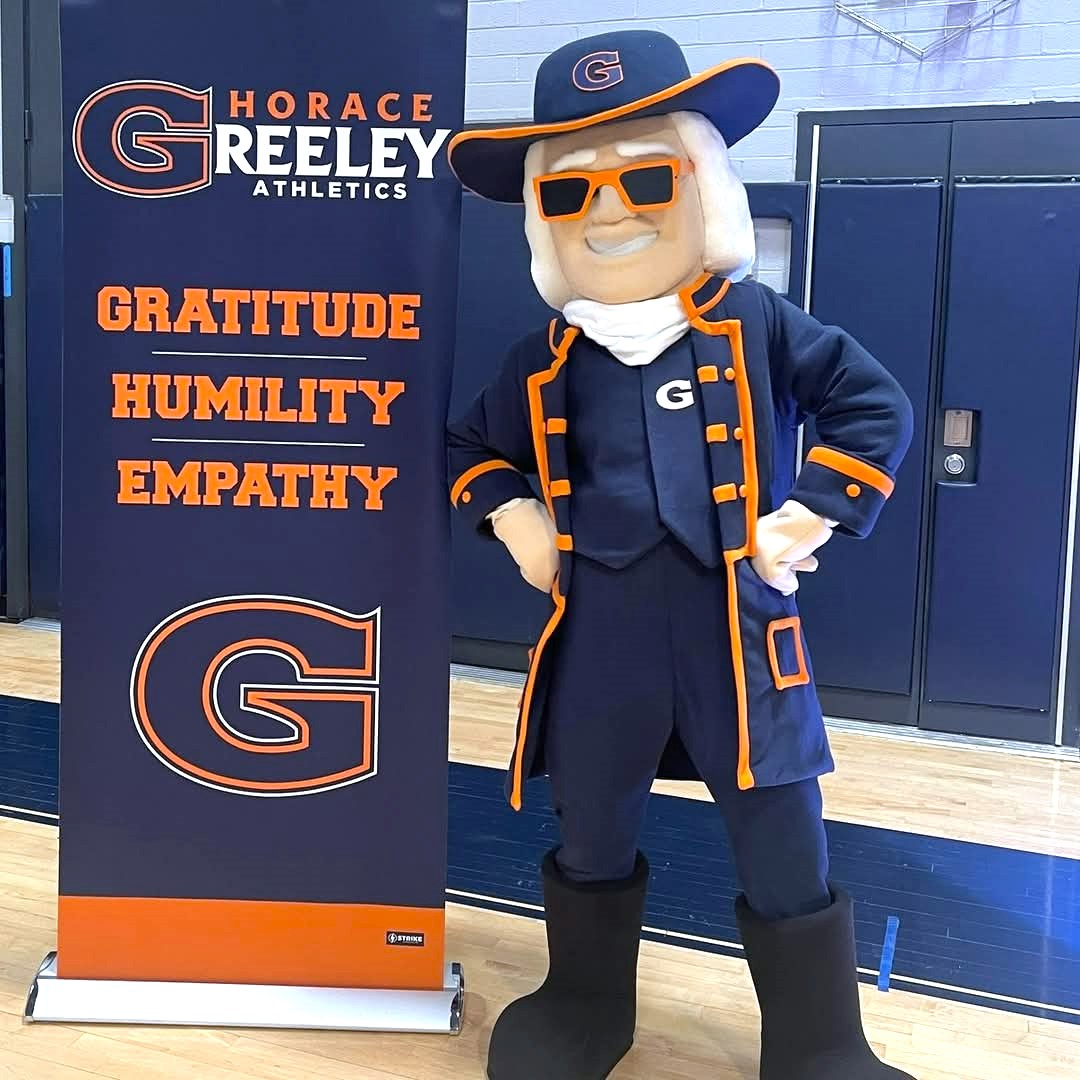 Quaker mascot with sign