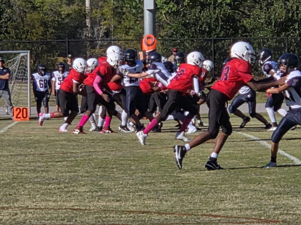 Football players in red and white jerseys