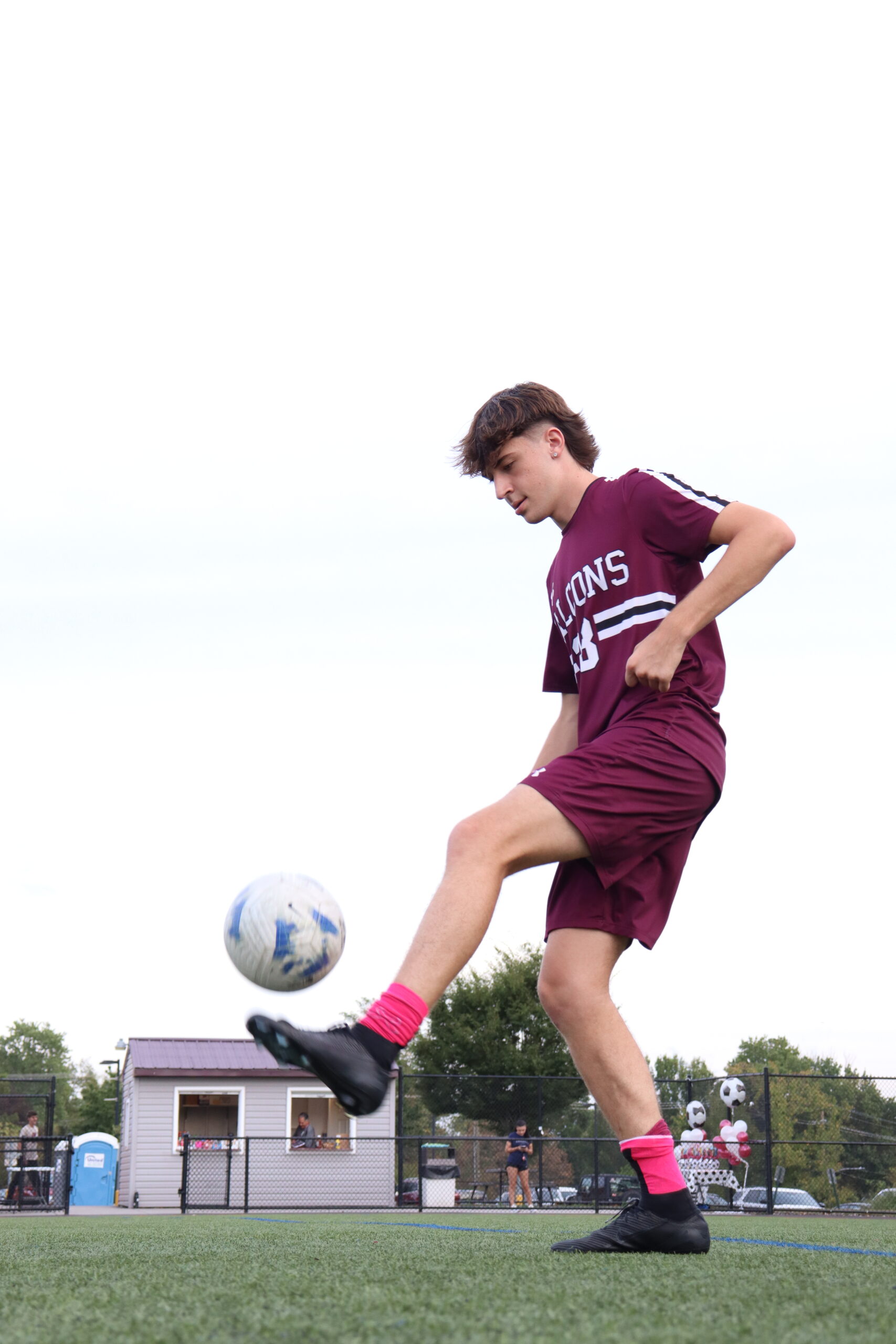 Logan Henzes with soccer ball