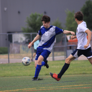 Emerson Kicking Soccer Ball