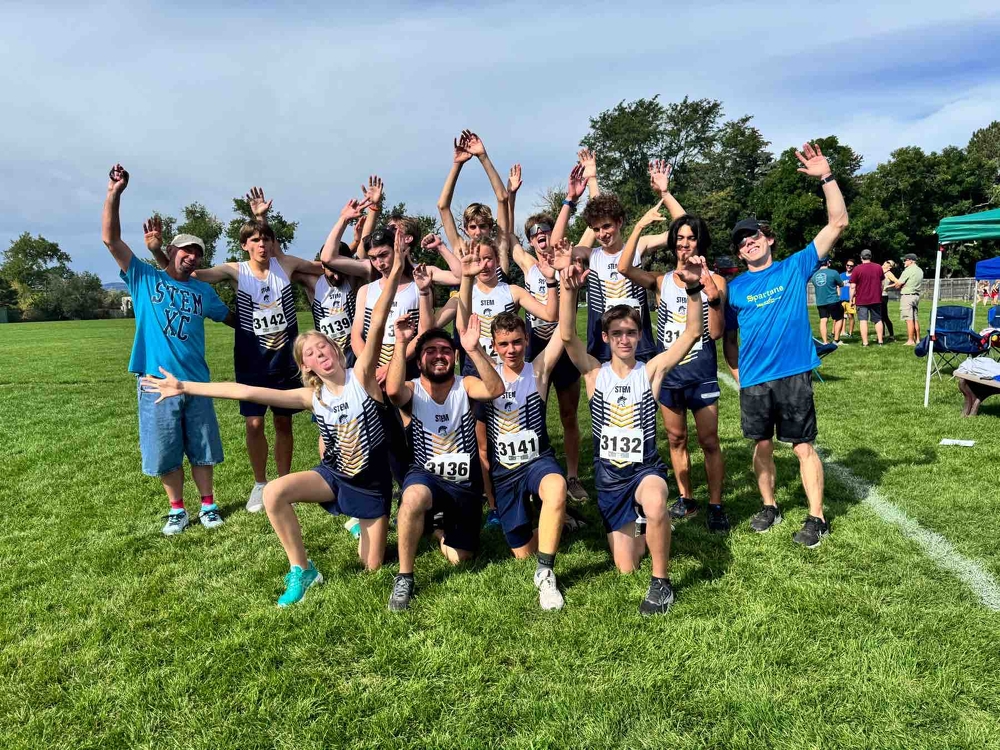 Cross Country team celebrating a fast day