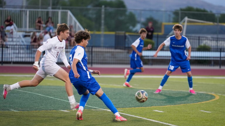 Denver Christian boys soccer players in action