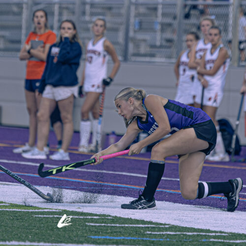 Player reaching for the ball on a field