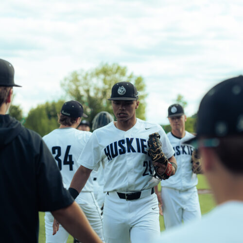 Baseball player gets ready to shake hands after a game.