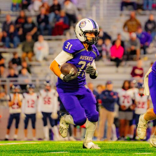 Football player running with the ball
