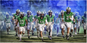 ThunderRidge Football Team Running Through the Blue Smoke.