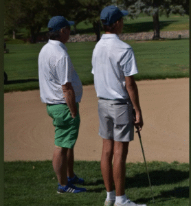 Head Coach Dan Singleton standing next to Sean Wisler at State 2024.