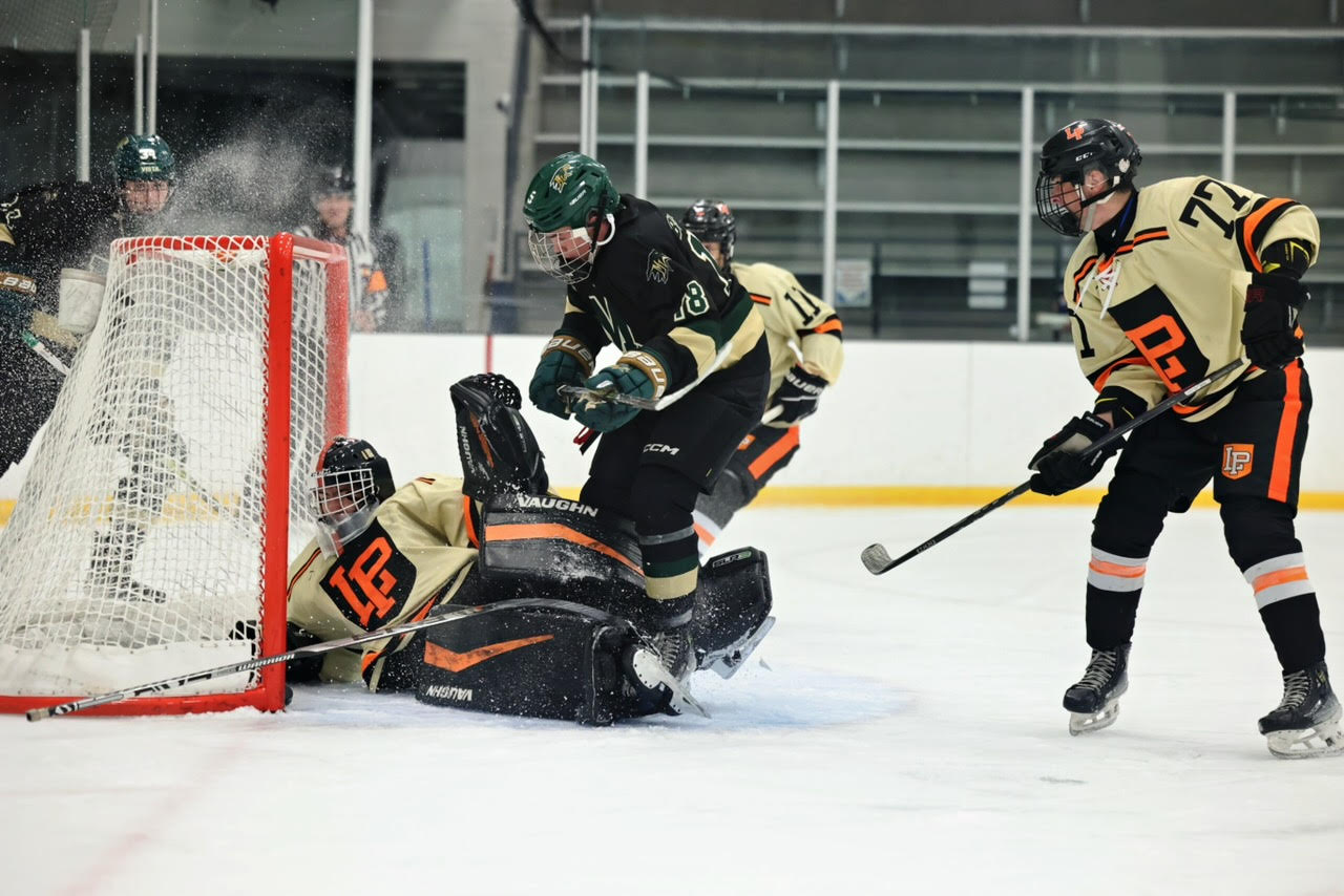 Connor Hitzig from ThunderRidge crashing the net for a goal