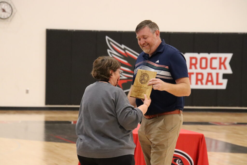 Mrs. Hubert receiving award