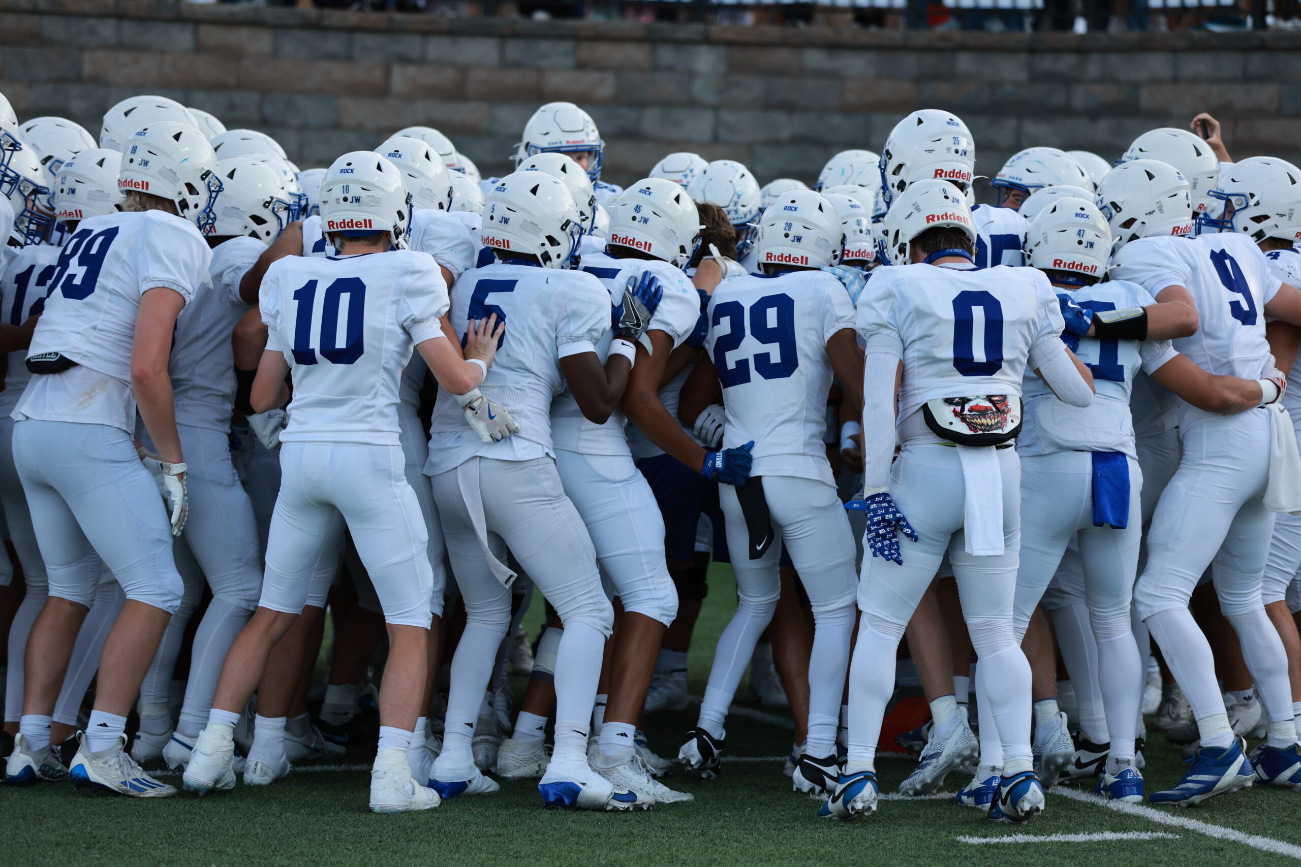 Team Huddle Rock Football