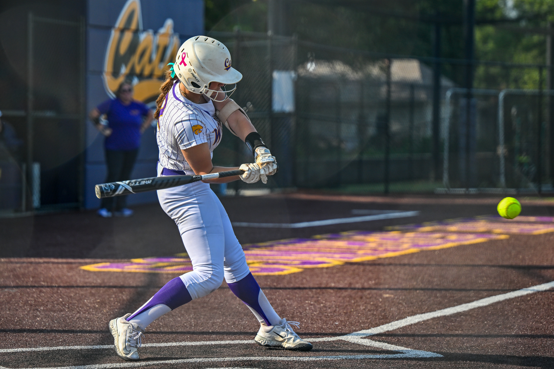 Blue Springs softball player batting.