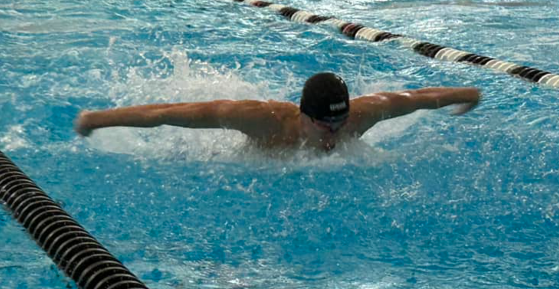 Blue Springs swimmer competing in butterfly.