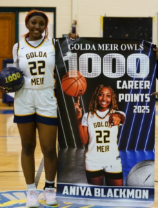 Aniya Blackmon with 1,000 Points Scored Sign