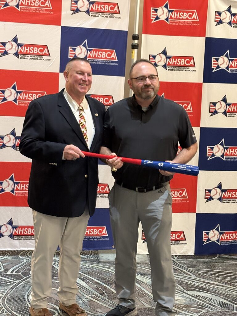 Baier accepting award. 