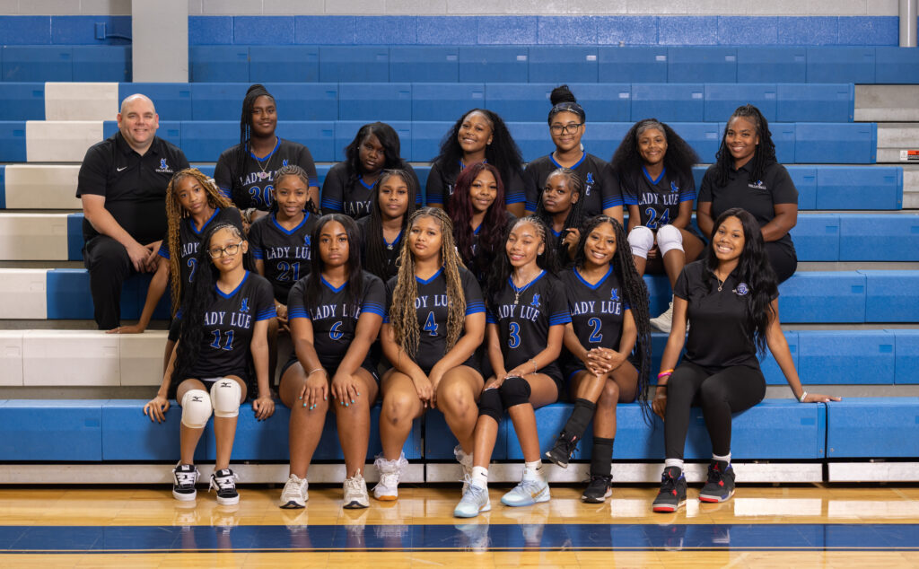 JV Team Photo seated on bleachers