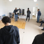 Quince Orchard varsity soccer team participates in an event at the Pleasant View Historical Site where they learned some of the history of the church and one-room school house as well as did clean-up of the grounds and helped reset furniture in the historic one-room school house	.