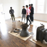Quince Orchard varsity soccer team participates in an event at the Pleasant View Historical Site where they learned some of the history of the church and one-room school house as well as did clean-up of the grounds and helped reset furniture in the historic one-room school house	.