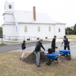 Quince Orchard varsity soccer team participates in an event at the Pleasant View Historical Site where they learned some of the history of the church and one-room school house as well as did clean-up of the grounds and helped reset furniture in the historic one-room school house	.