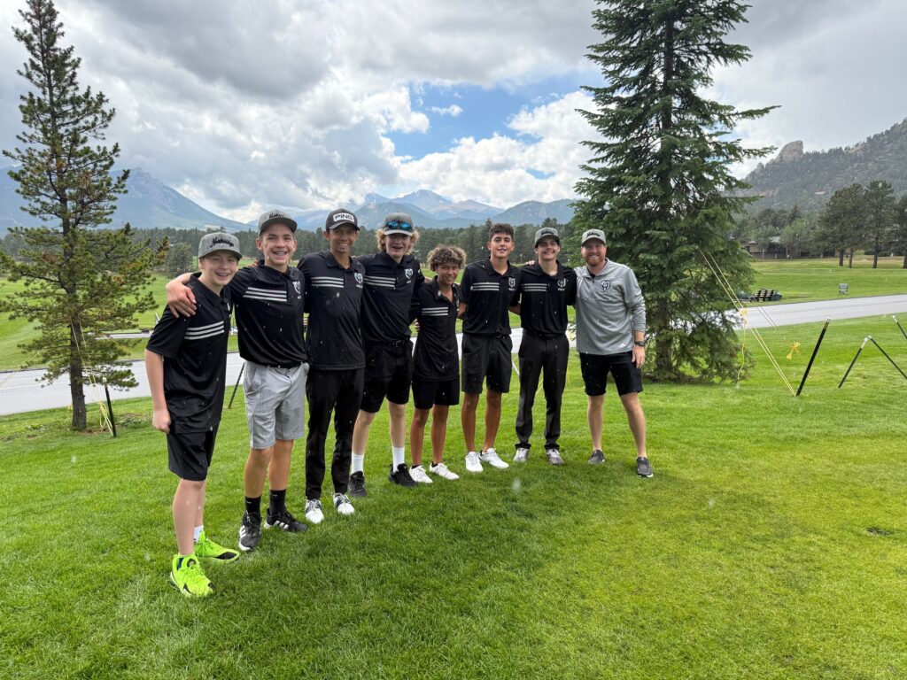 Boys golf team standing together after a tournament