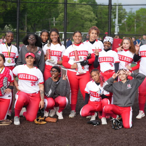 Softball team celebrating RCAC tournament win