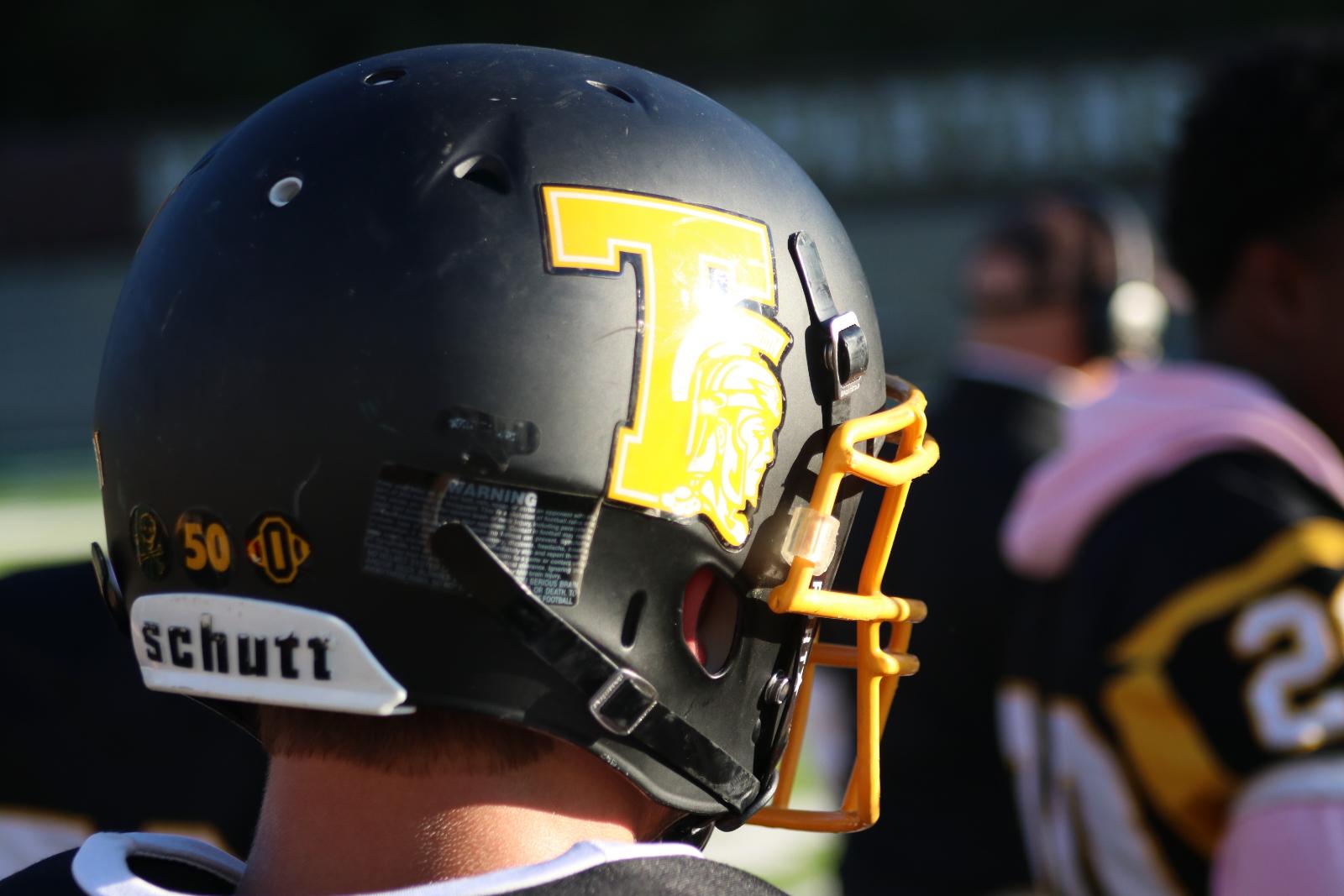 The back of a Titans helmet atop a player's head.
