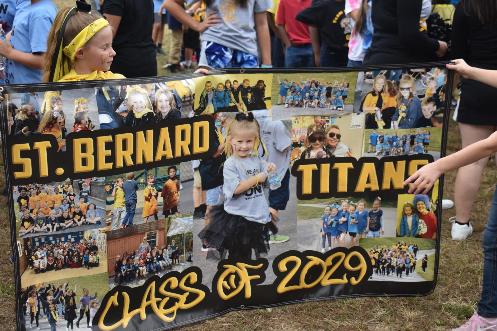 Students hold up a sign that reads "St. Bernard Titans Class of 2029"