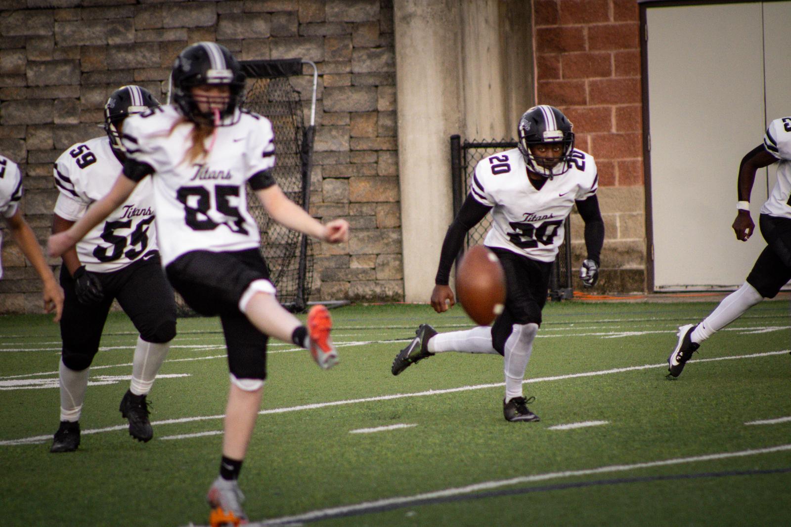 The SBEP kicker punts the football.