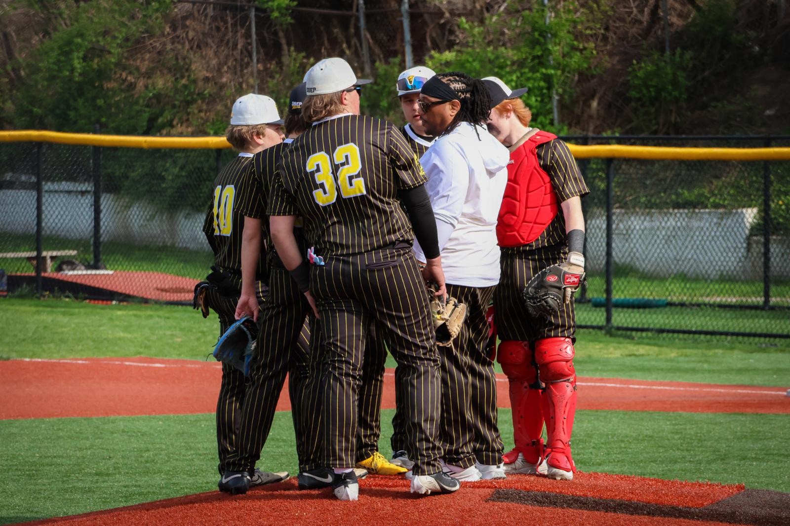 The SBEP Titans baseball team gathers together for a meeting.
