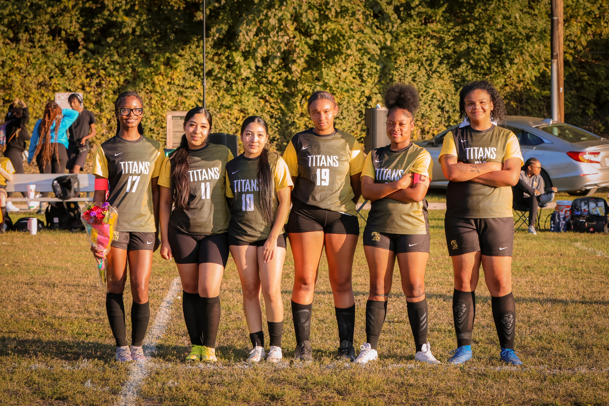 The SBEP senior soccer players pose together for a photo.