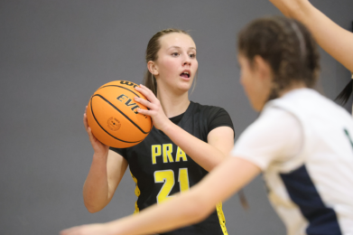female basketball player holding a ball