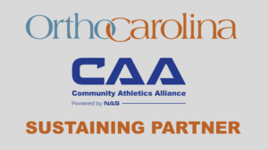 For 13 years, OrthoCarolina has partnered with NAS to support public school athletic programs, caring for student-athletes and supporting the programs that serve them. The expanded partnership through the Community Athletic Alliance (CAA) program, builds on that foundation enhancing student development, leadership opportunities, and community engagement while continuing to support athletic events across participating districts. “OrthoCarolina has proudly supported Public School Athletics for more than a decade, and expanding this partnership is a natural next step. Beyond caring for the student athletes across the regions, we believe deeply in the power of sports to shape young people and communities. These new initiatives allow us to invest even more meaningfully in students, schools, and the future of youth athletics,” said Blair Primis, chief growth officer at OrthoCarolina. The expanded partnership reflects a broader effort to strengthen public school athletics through collaboration, long-term investment, and community-centered programming across the Carolinas. Watch the video below to learn more about this partnership!