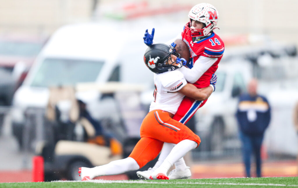 Morgantown football player catches a pass.