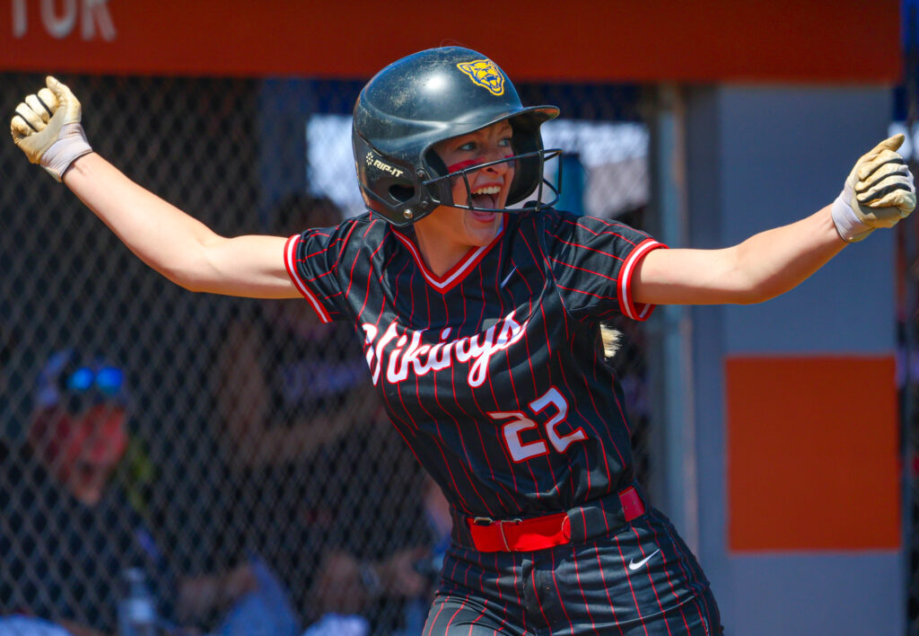 Petersburg player celebrates running home.