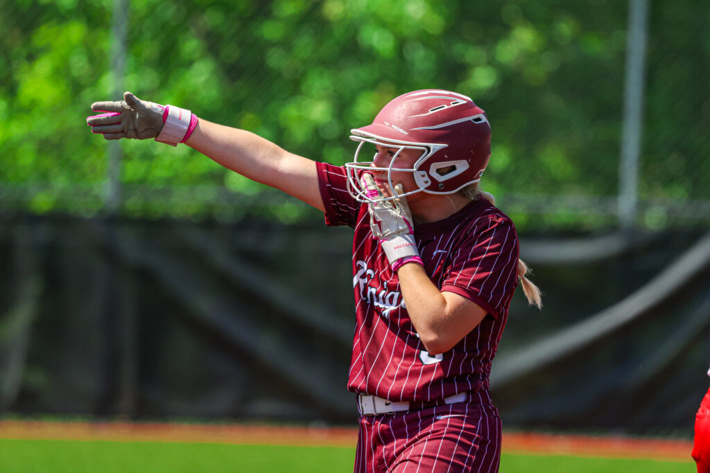 A Wheeling Central player celebrates on second base.