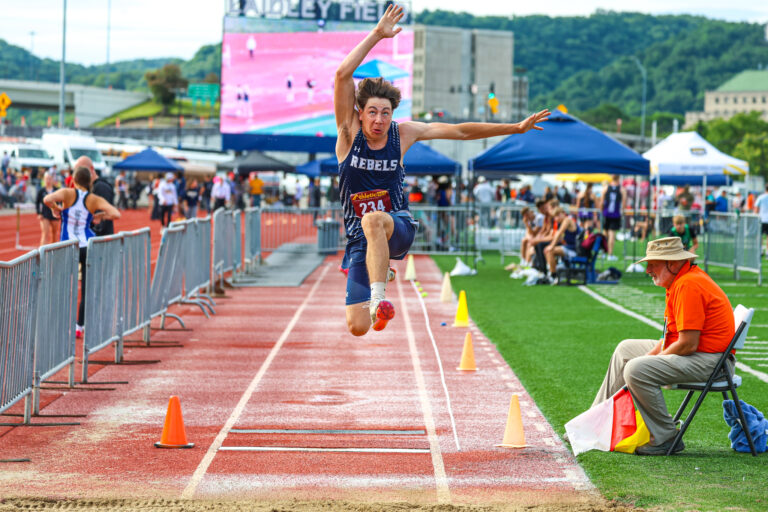 Track athlete does long jump.