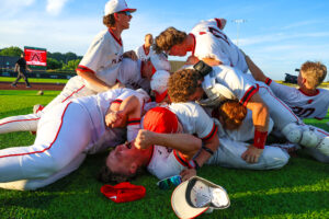 Baseball players celebrate a victory in a dog pile