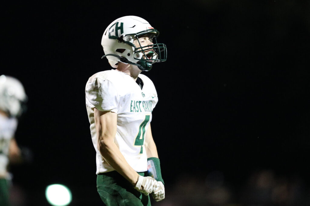 A football player celebrates a tackle.