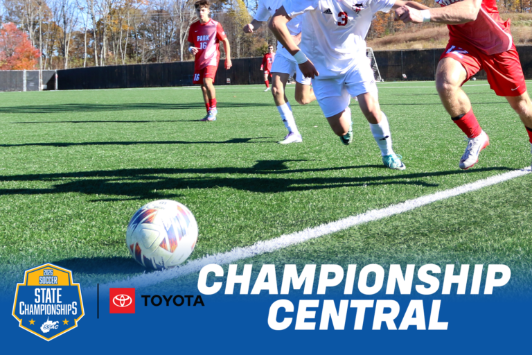 Soccer players in red and white uniforms chase a ball along the sideline of a turf field on a sunny fall day. Text reads “Championship Central” beside the 2027 WVSSAC Soccer State Championships logo and the Toyota logo.
