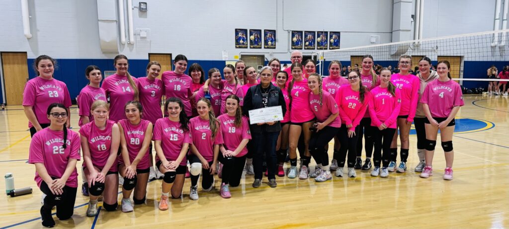 Gouverneur junior varsity volleyball pink night donation group photo