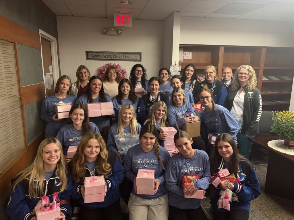 Ogdensburg Free Academy varsity volleyball group photo delivering comfort products to Richard E. Winter Cancer Center in Ogdensburg
