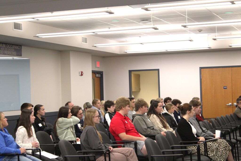 High school students listening to a presentation