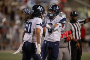 McDowell players celebrating a good play on the field.
