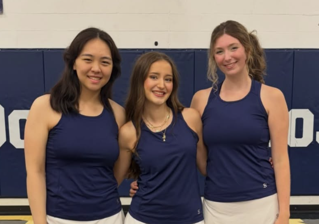 mcdowell seniors pose together at senior day in gym.